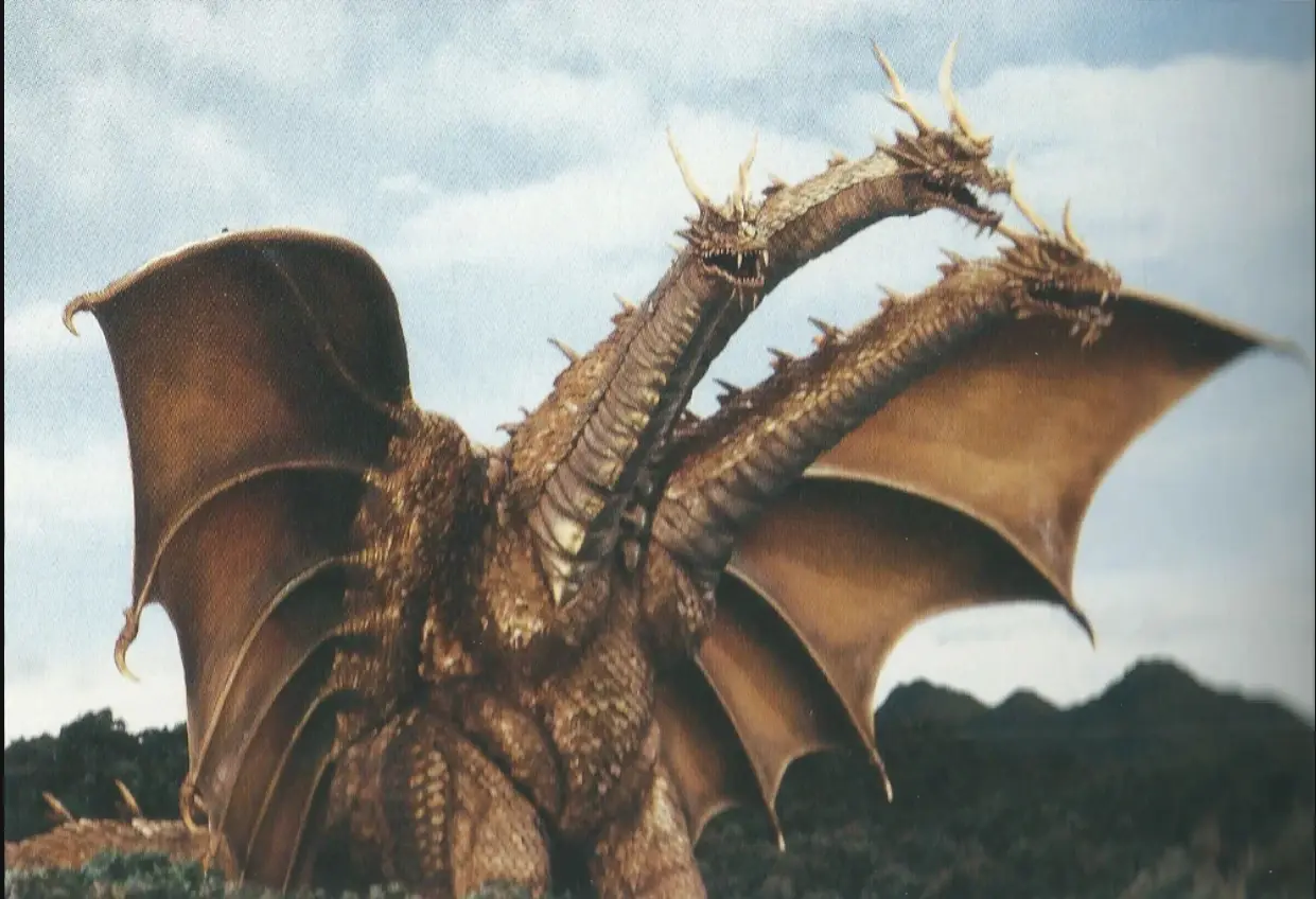 King Ghidorah as he appears in Rebirth of Mothra 3. A gold three headed long-necked dragon.